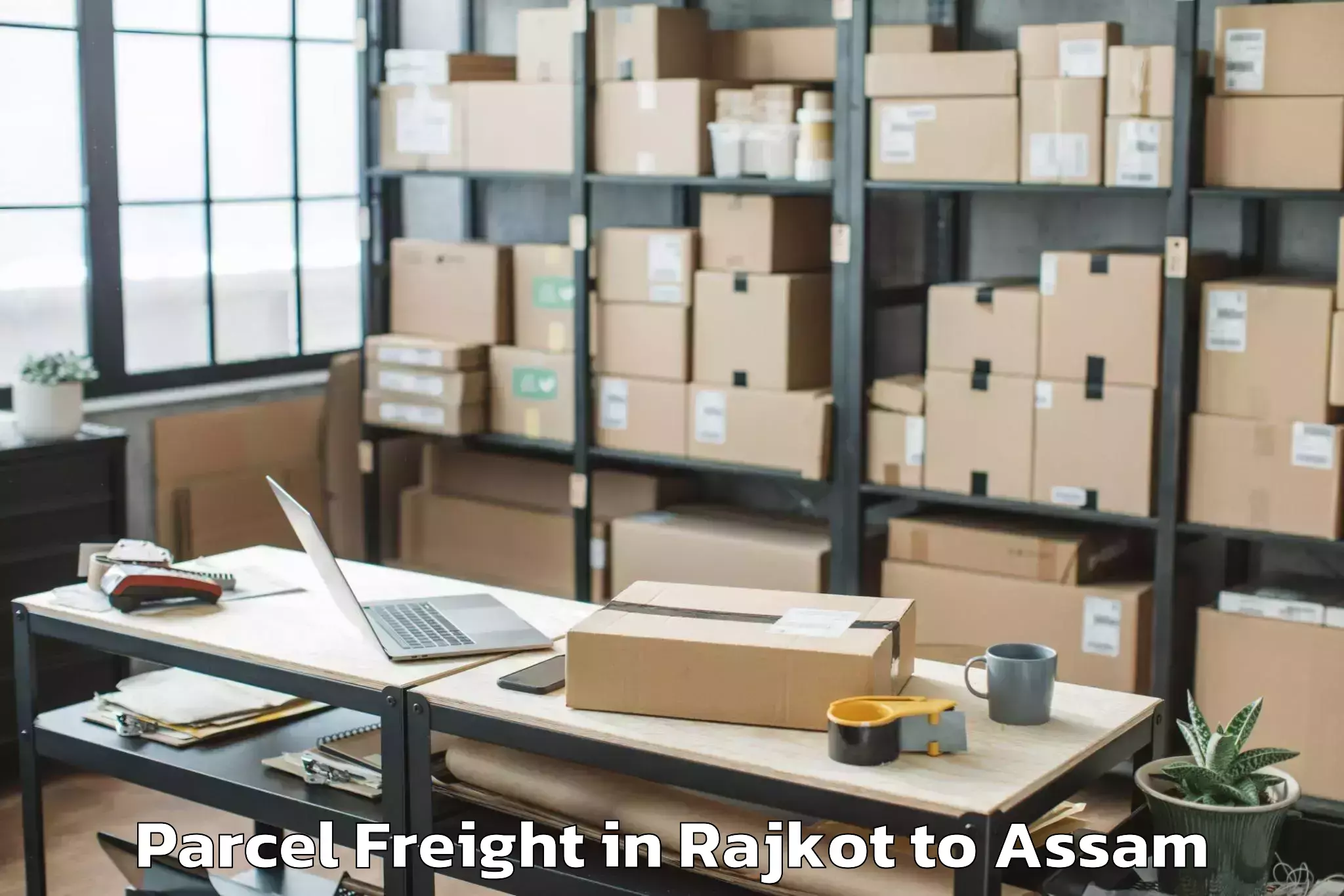 Book Rajkot to Morigaon Parcel Freight